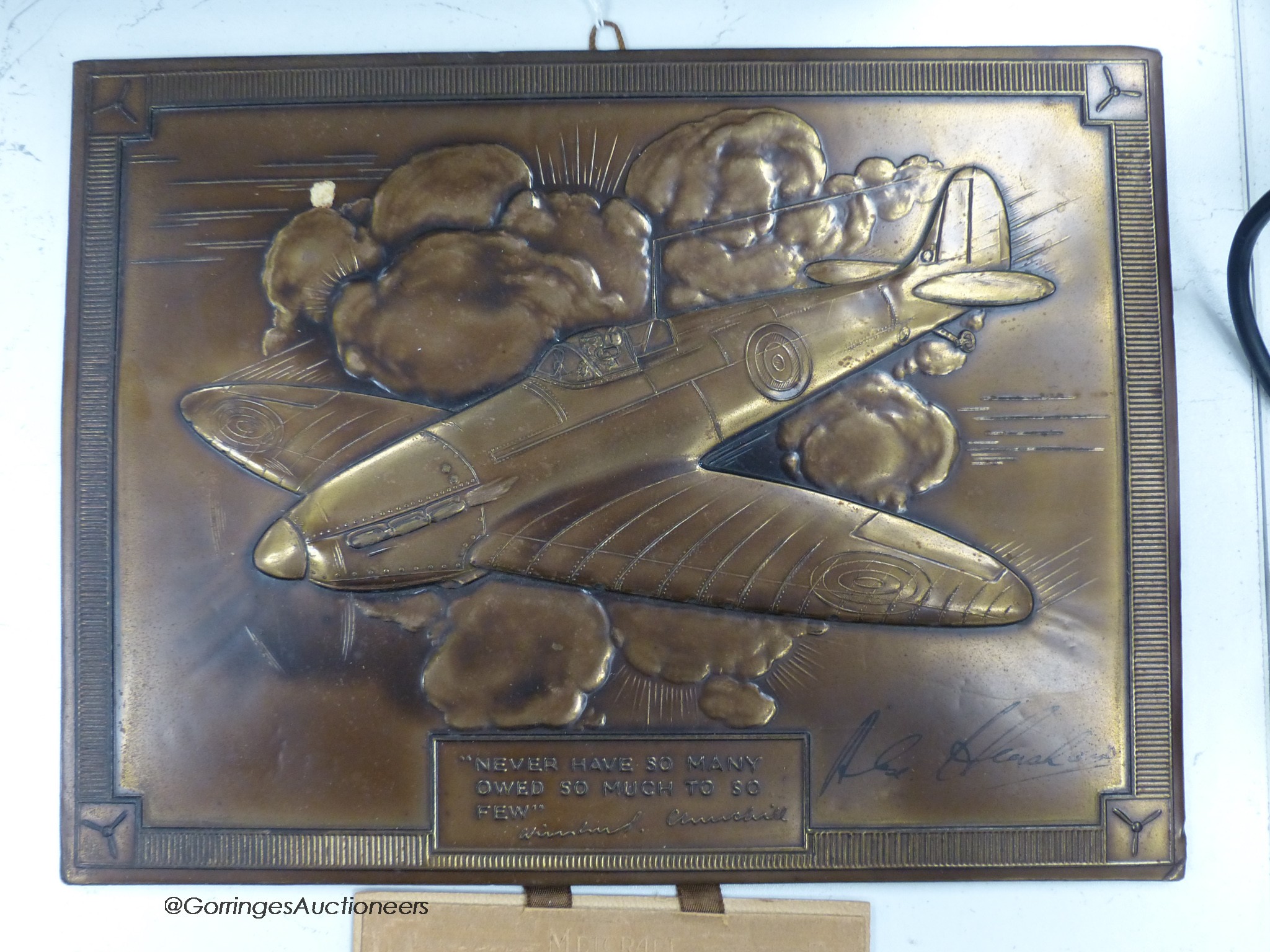 A 1941 calender, bronze finish signed by Alex Henshaw, air racer and test pilot for Vickers Armstrong